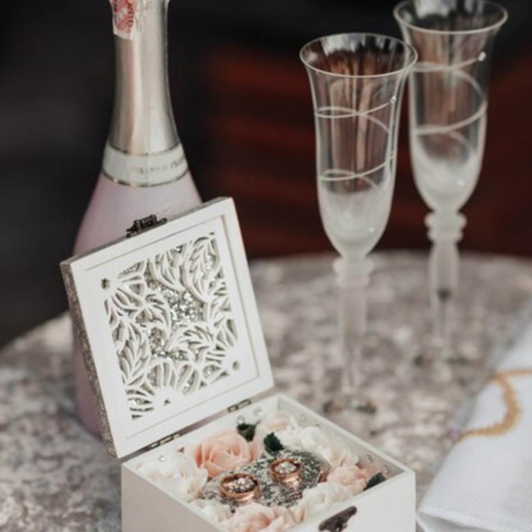 "Elegant engraved glass gifts including custom toasting glasses, wedding centerpieces, and keepsake boxes."